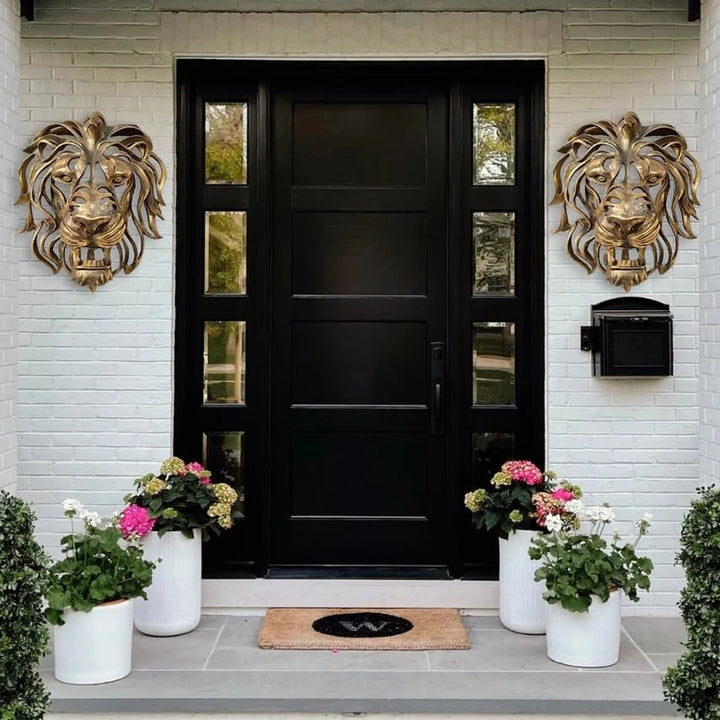 Majestic metal lion head, an impressive piece of wall art for a grand entrance.