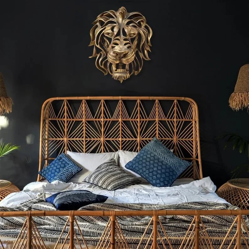 Unique metal lion head wall hanging, blending strength with elegant artistic design.