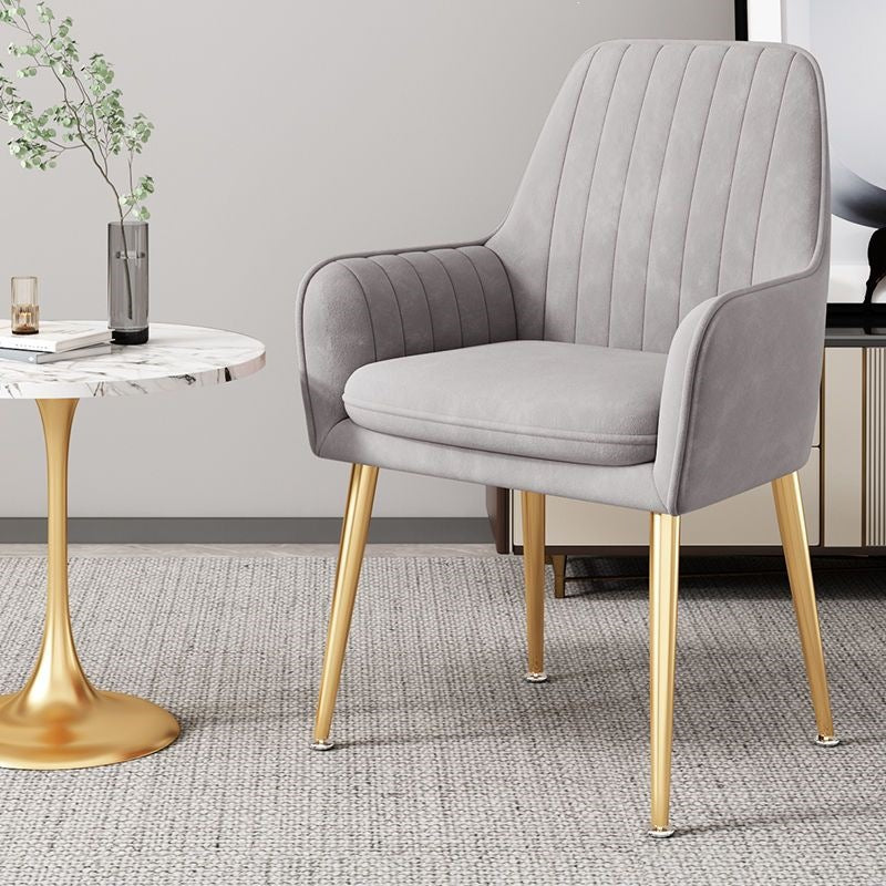 Stylish living room furniture: a modern accent chair with elegant gold legs.