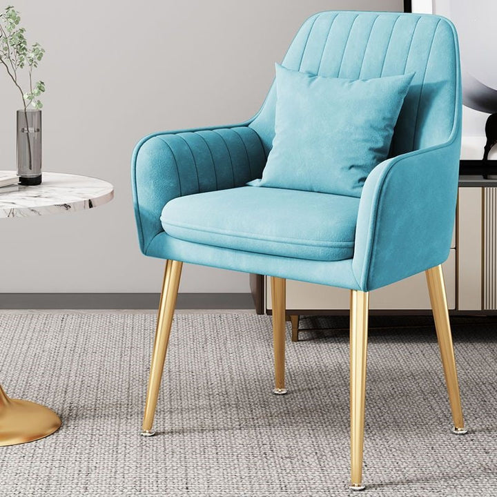 Elegant living room accent chair, features sturdy gold metal legs.