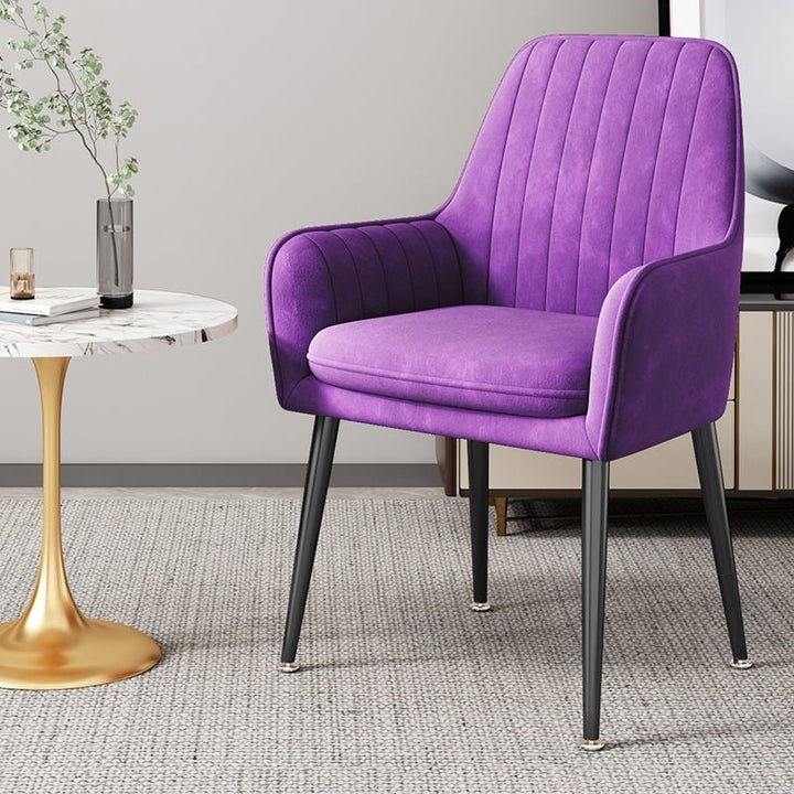 Versatile compact accent chair with golden legs, ideal for various settings.