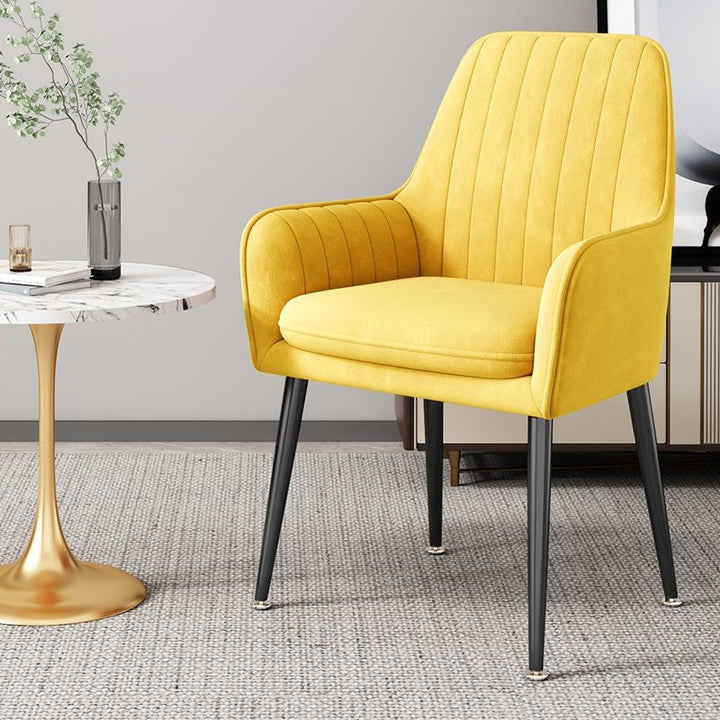 Comfortable chair with sturdy gold-finished legs, ideal for office lounges.