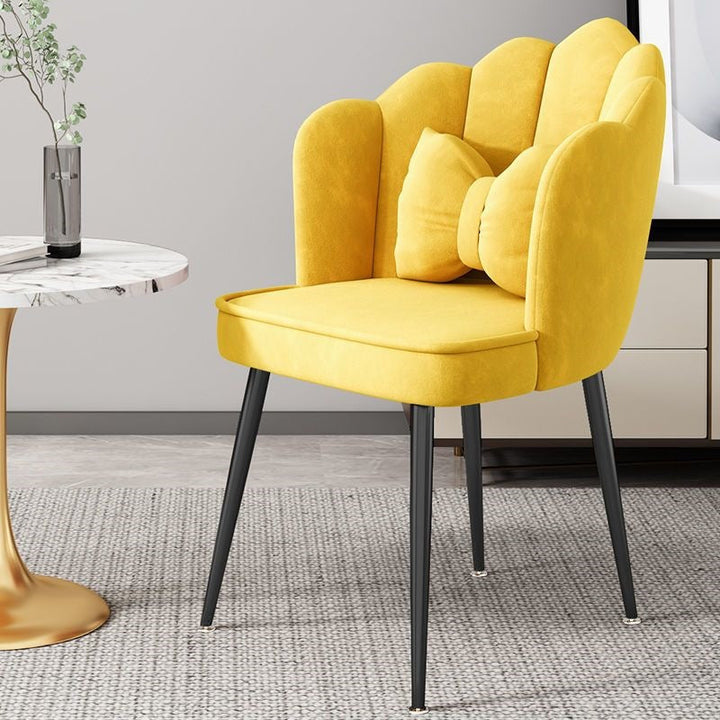 Soft upholstered accent chair with gold legs, enhancing any modern decor.