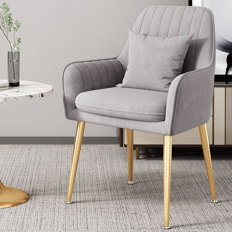 Sophisticated accent chair with golden legs, blending elegance and comfort.
