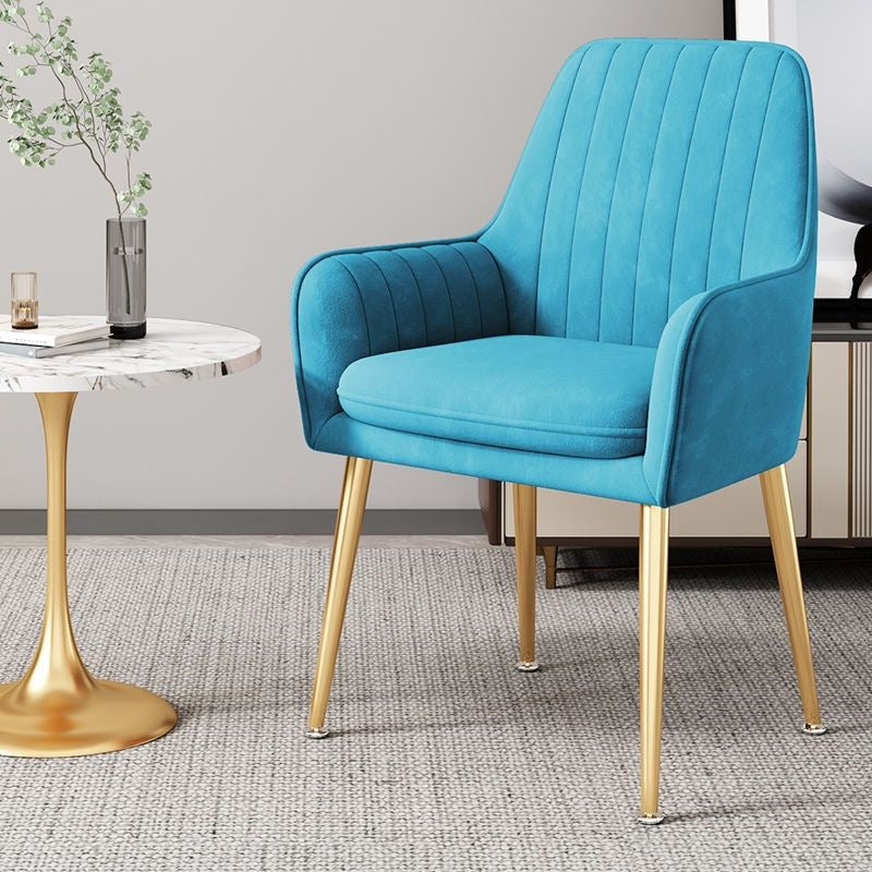 Designer-look accent chair with gold legs, perfect for stylish home decor.