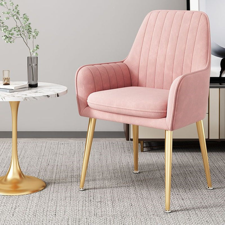 Upgrade your living space with this elegant gold-legged accent chair.