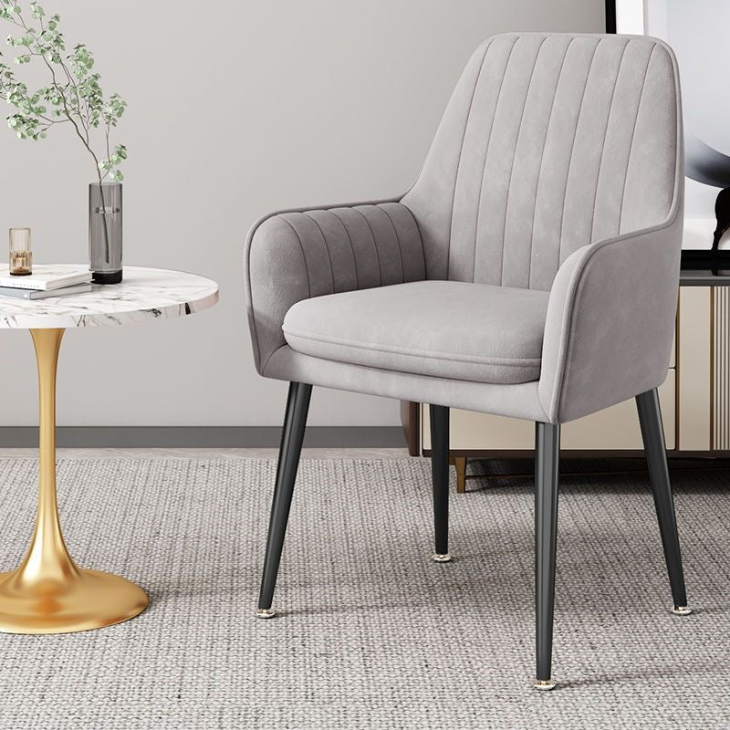 Modern design accent chair with shiny gold legs, great for contemporary homes.
