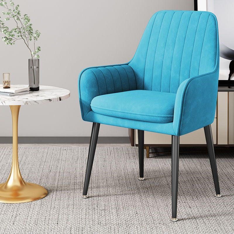 Fashionable accent chair with gold legs, adds comfort and elegance to bedrooms.