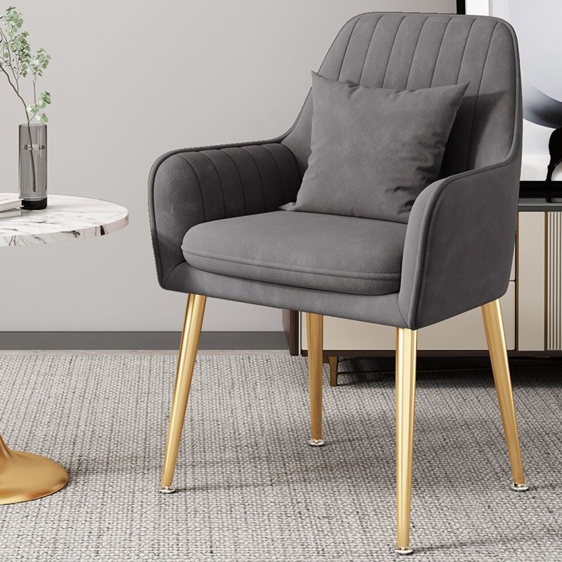 Unique gold leg accent chair, a stylish and comfortable piece of modern furniture.