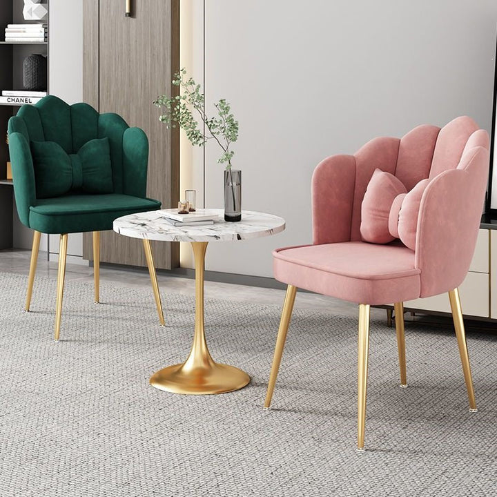 Comfortable elegant accent chair with shimmering gold legs for home decor.