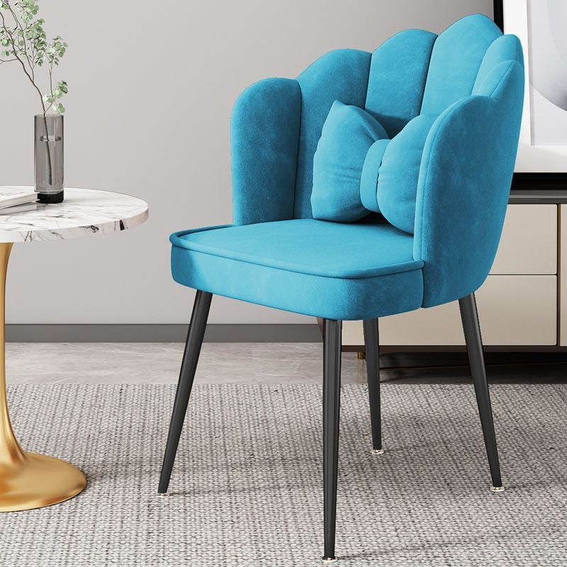 Luxurious bedroom accent chair with elegant gold legs and soft upholstery.