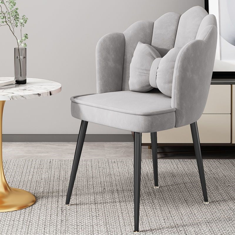 Modern accent chair with striking gold metal legs, enhances any living room.