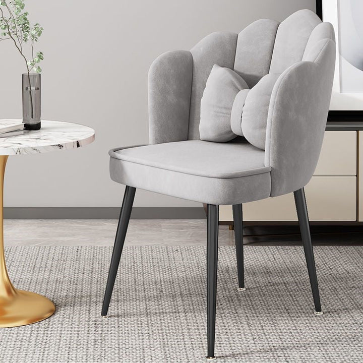 Modern accent chair with striking gold metal legs, enhances any living room.
