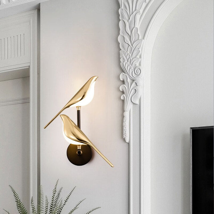 Stylish modern bird wall lamp providing warm LED ambient lighting, ideal for contemporary home decor.