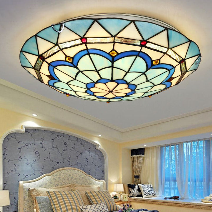 Decorative flush mount ceiling light for a modern living room or bedroom, offering ambient lighting.