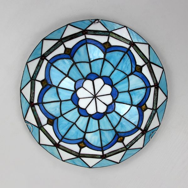 Space-saving flush mount ceiling light, an elegant modern fixture ideal for low-ceiling rooms.
