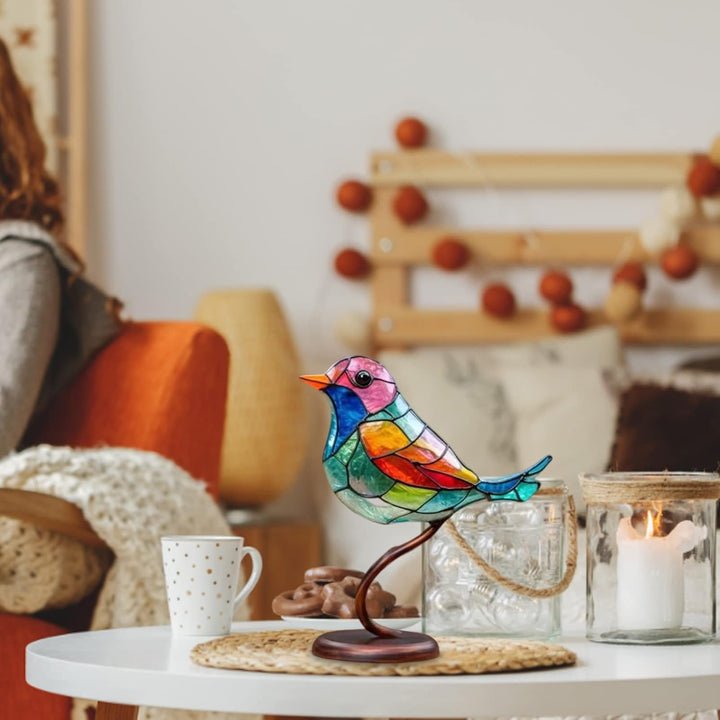 Vibrant glass bird art sculpture. Unique modern decorative piece for any table or shelf.