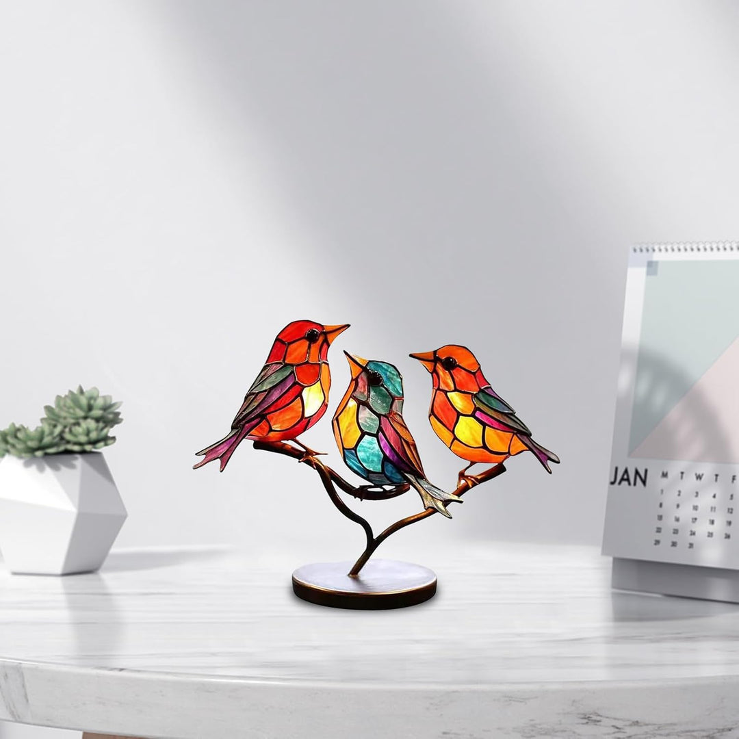 Artistic colored glass bird sculpture. Modern decorative art with vibrant glass hues.