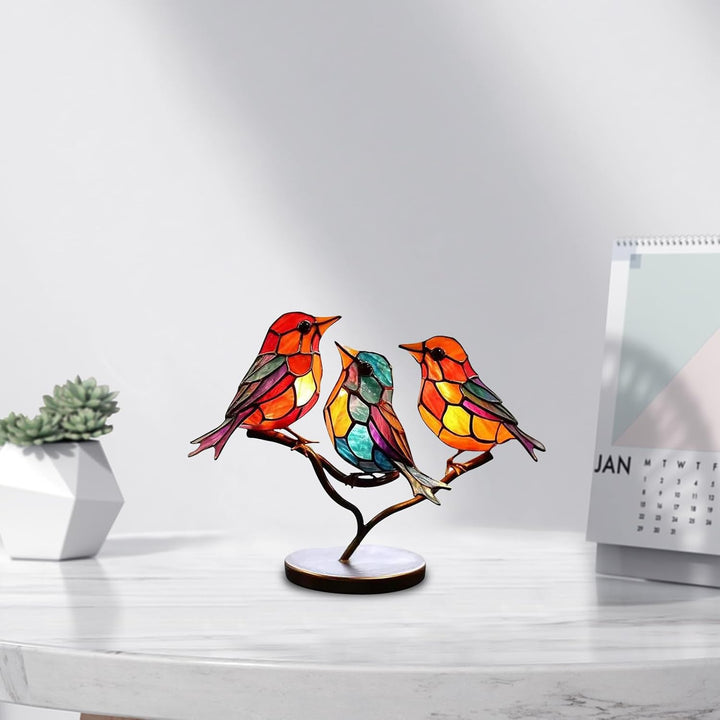 Artistic colored glass bird sculpture. Modern decorative art with vibrant glass hues.