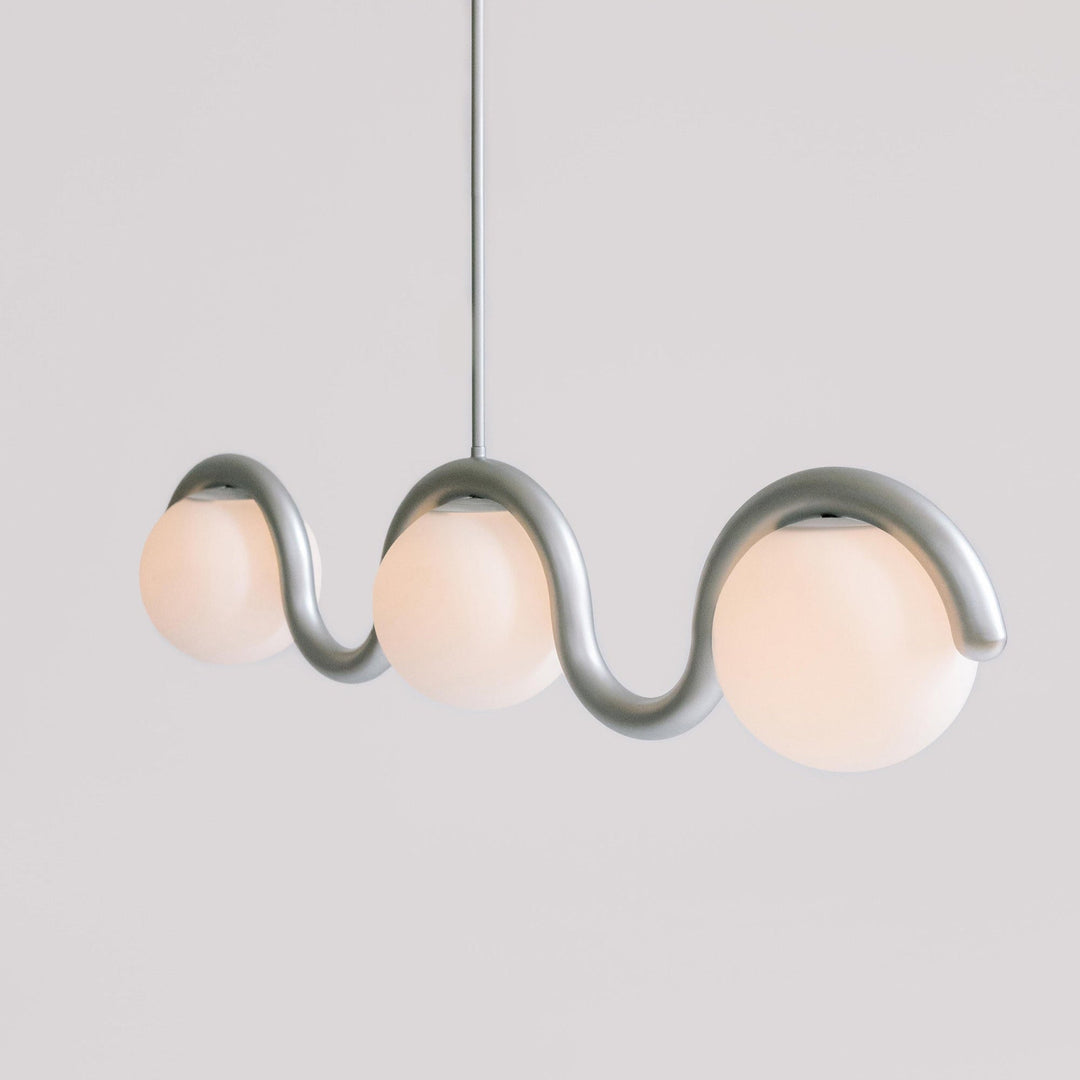 Elegant linear metal fixture for dining room.