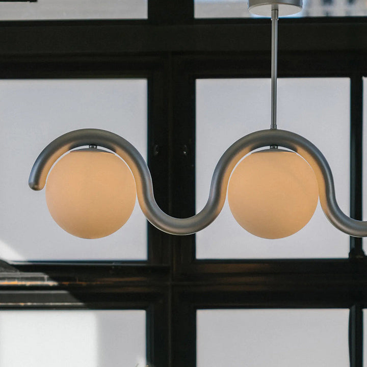 Modern linear chandelier, glass accents, living.