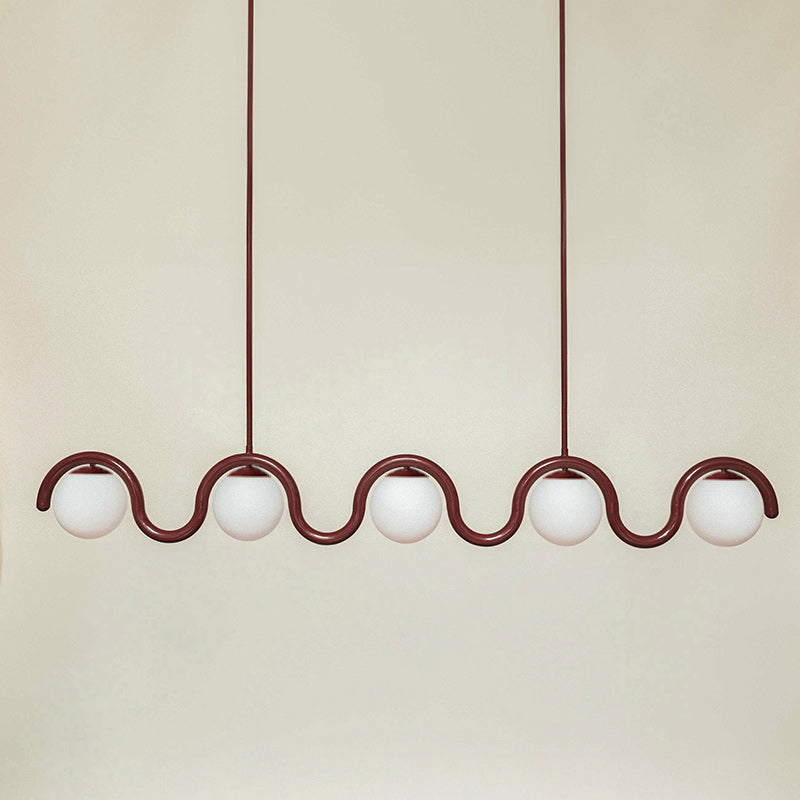 Contemporary glass & metal linear pendant.