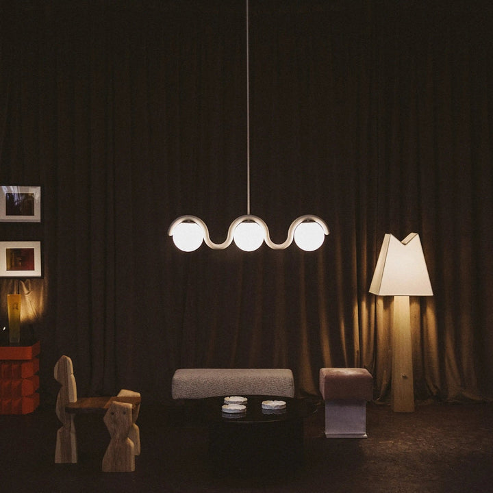 Designer linear light for elegant dining area.
