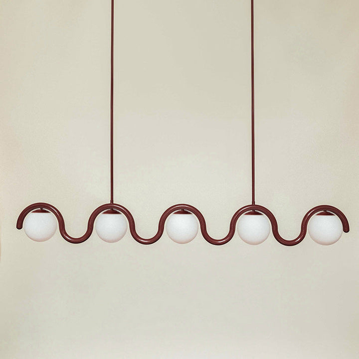 Contemporary linear pendant, glass & metal blend.