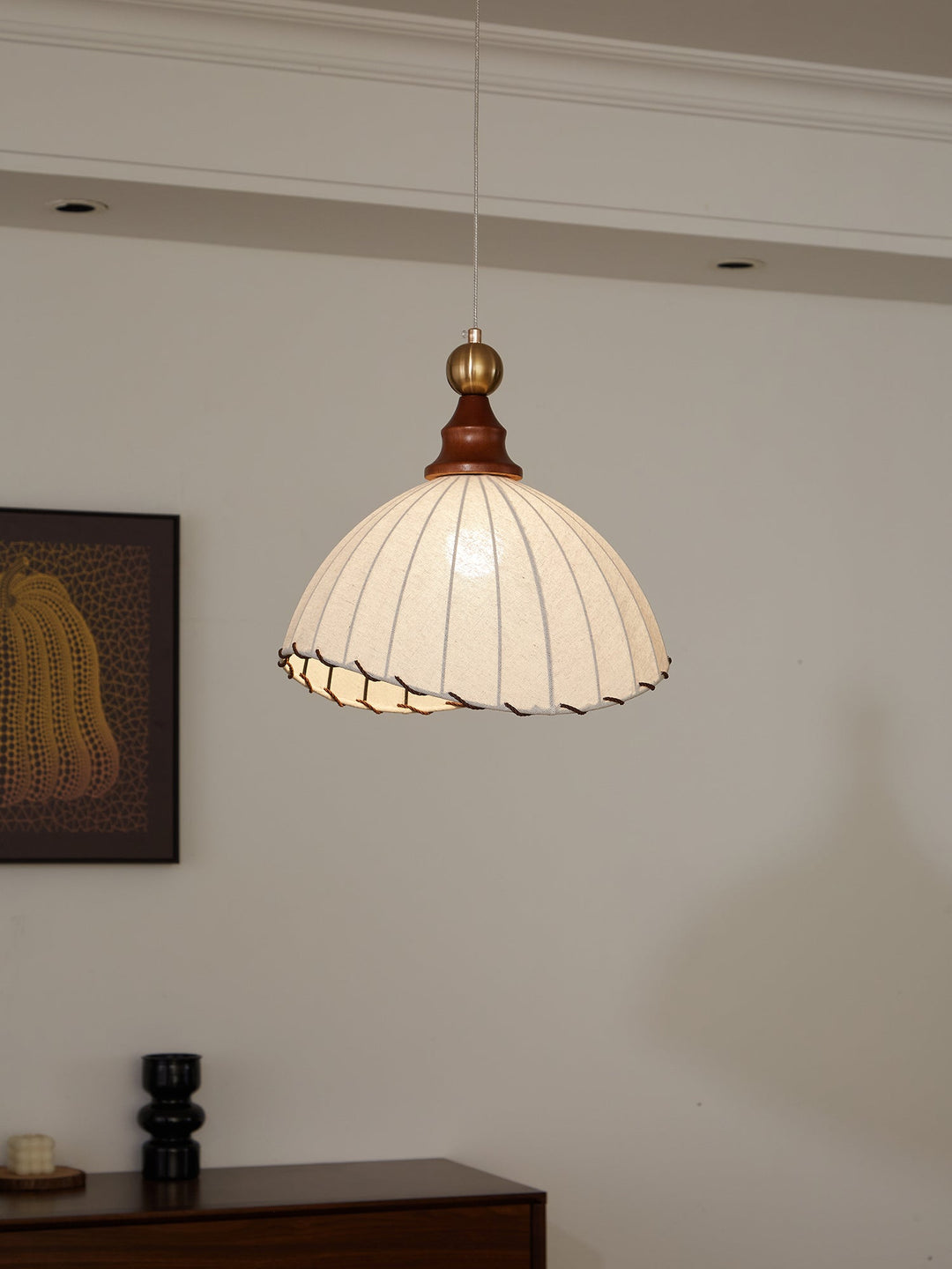 Ceiling lamp, elegant design, fabric shade, gold accent, wood details, ideal for modern homes.