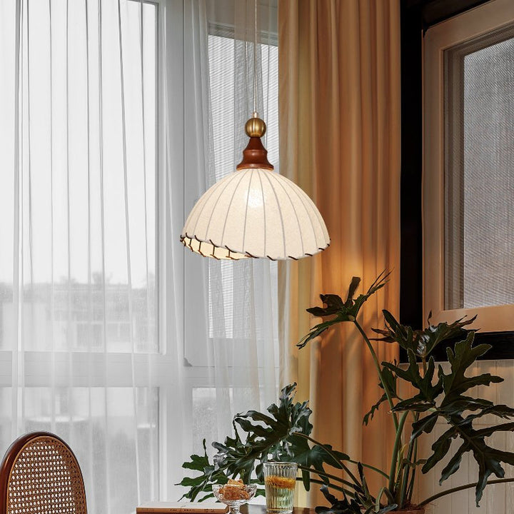 Sophisticated pendant light, perfect for home decor, with an elegant fabric shade & gold base.