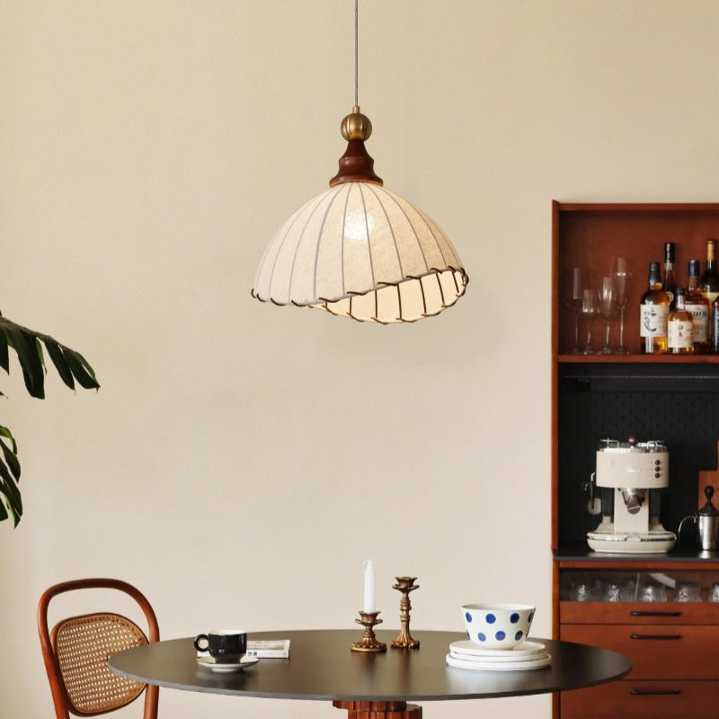 Home decor pendant lamp: modern design, fabric shade, gold details, and natural wood accents.