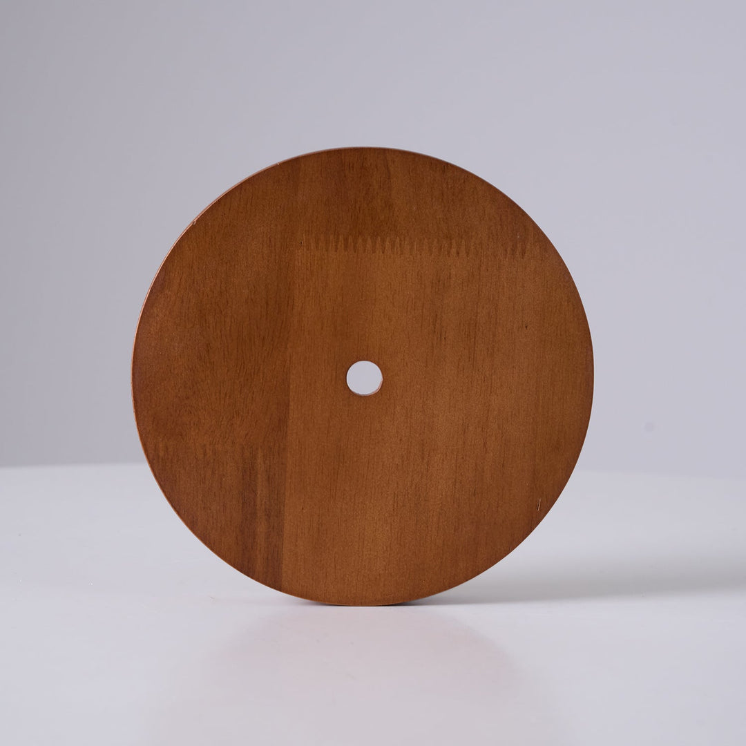 Modern adjustable pendant light, showcasing the natural beauty of wood and travertine in a minimalist design.