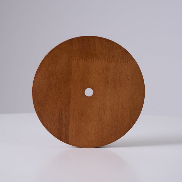 Modern adjustable pendant light, showcasing the natural beauty of wood and travertine in a minimalist design.