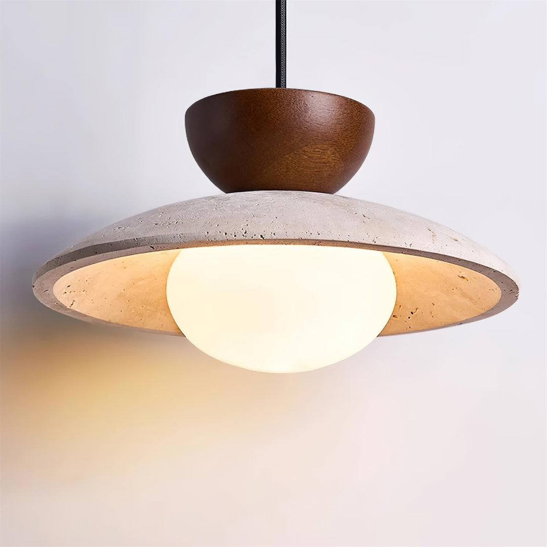 Architectural pendant light: Natural wood top, travertine body, and glass diffuser for ambient lighting.