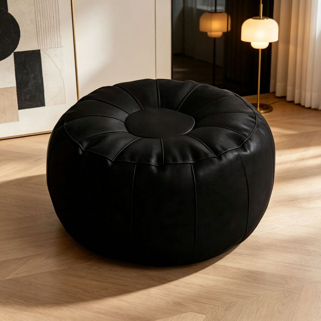 Stylish round accent stool with modern design, providing elegant and comfortable seating for any room.