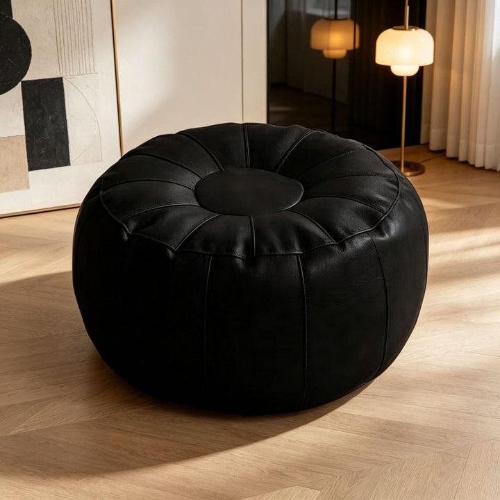 Stylish round accent stool with modern design, providing elegant and comfortable seating for any room.