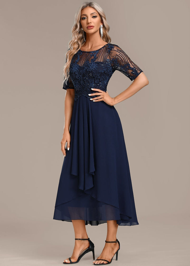 Full shot of a chic women's navy lace midi dress, elegant short sleeve style for formal occasions.