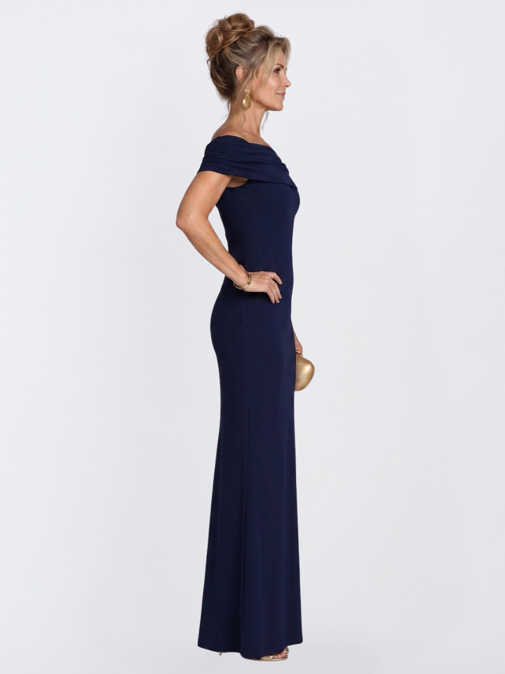 Burgundy ruched bodycon maxi dress for women, featuring an elegant off-shoulder neckline & flattering fit.