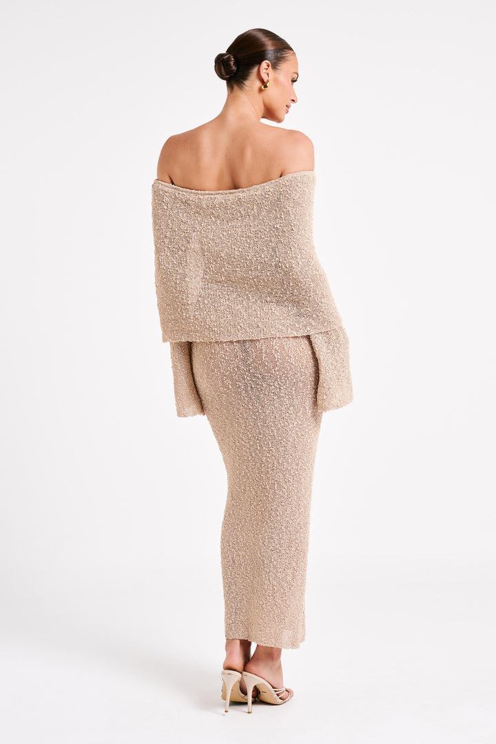 Elegant occasion dress: women's off-shoulder maxi, long sleeves, suitable for evening events.