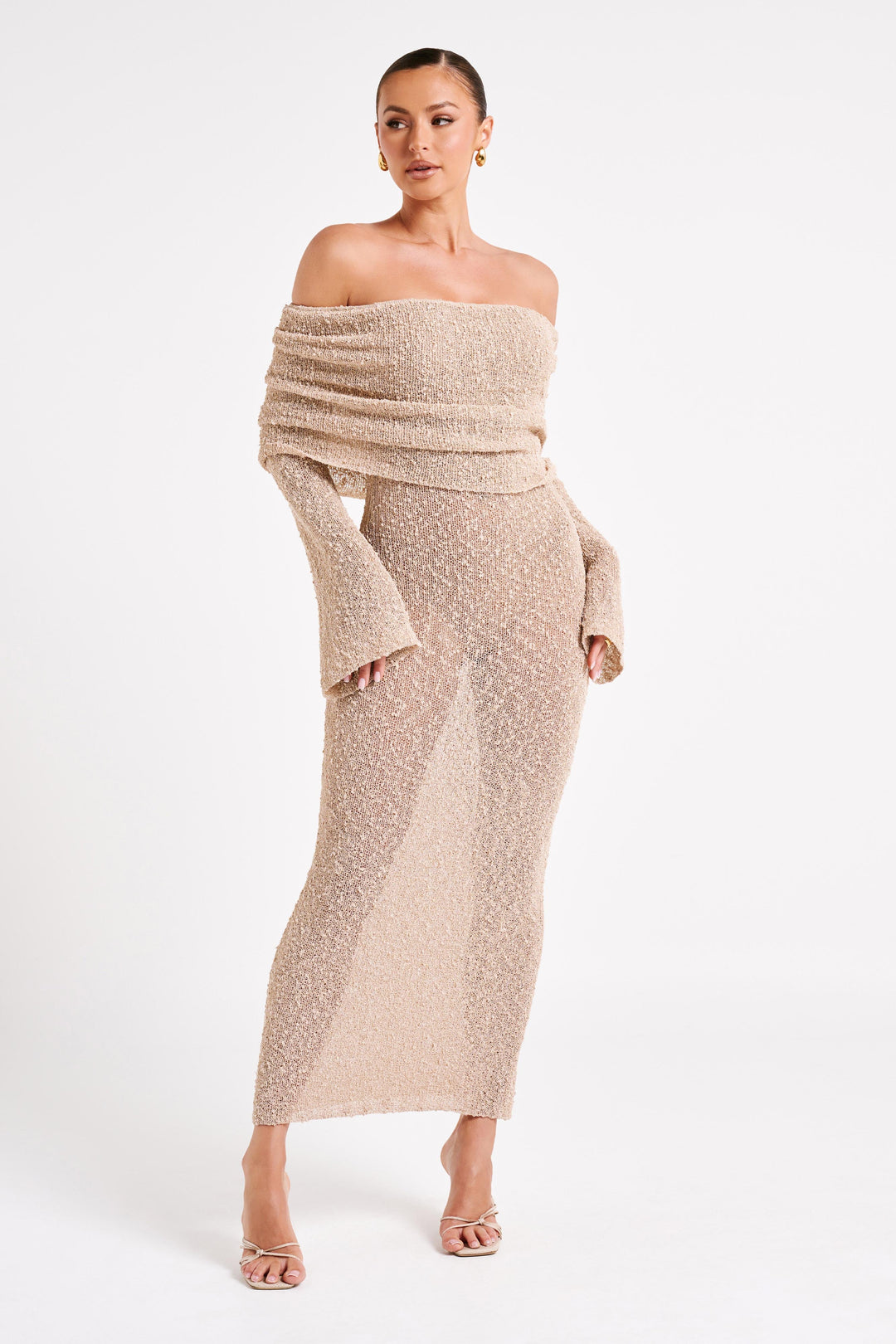 Sophisticated black evening dress, off-shoulder maxi style with elegant long sleeves.