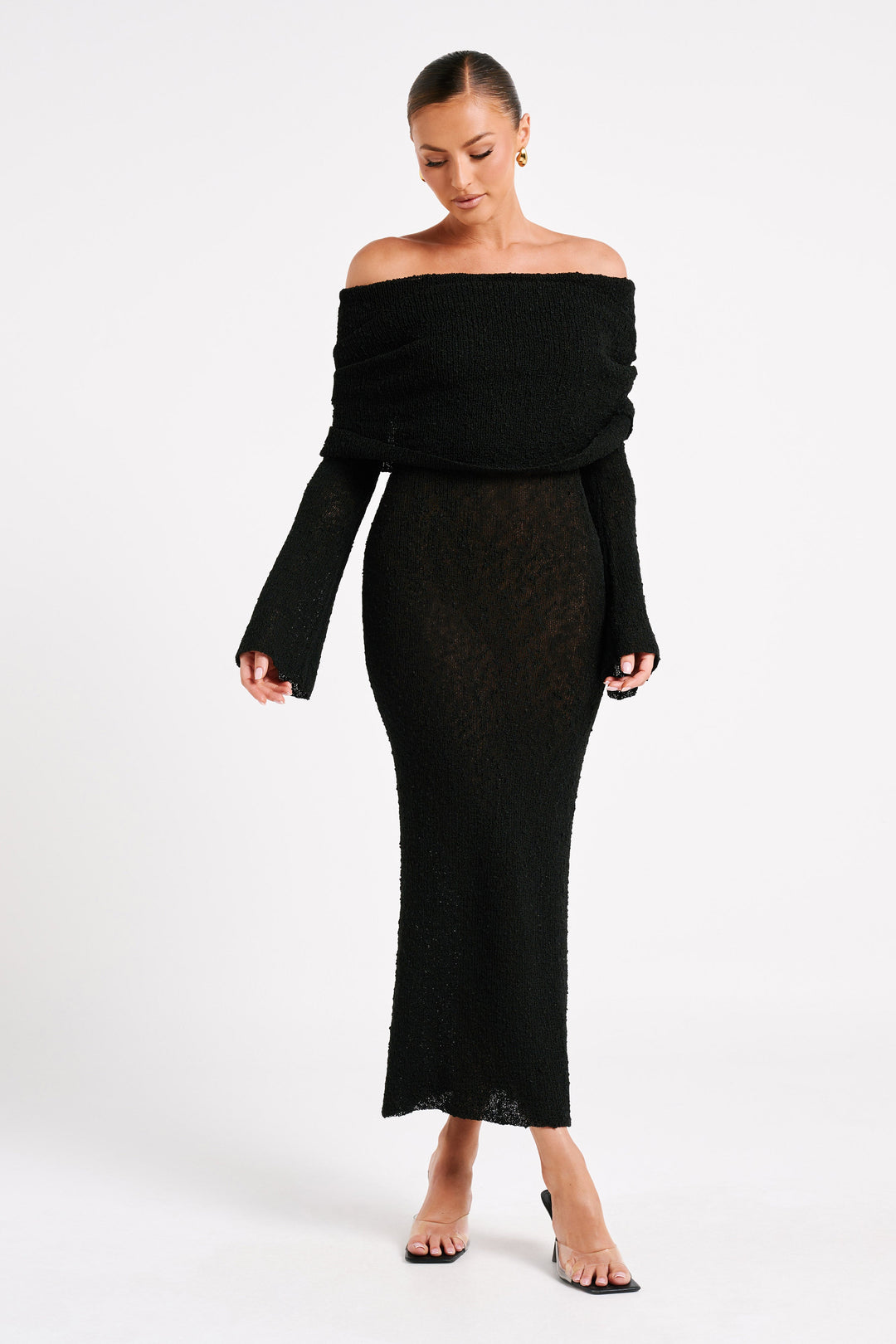 Luxurious off-shoulder maxi dress, long sleeve and textured for elegant evening occasions.