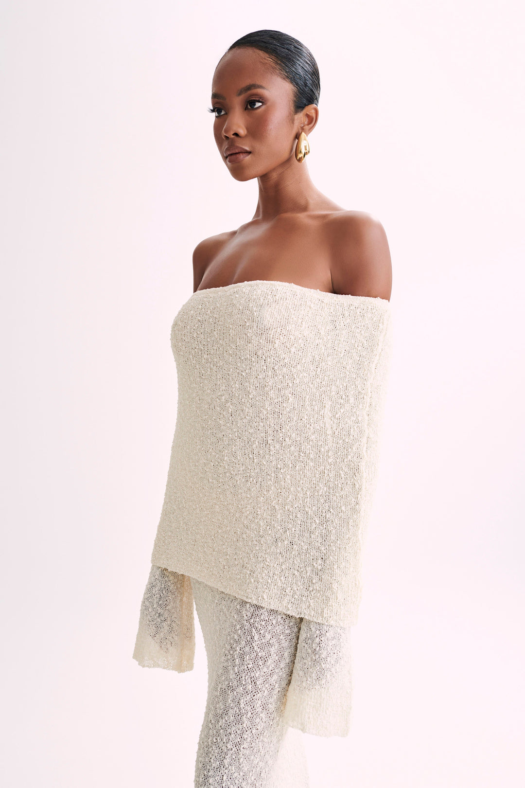 Luxurious timeless off-shoulder maxi dress, a feminine choice for elegant evening wear.