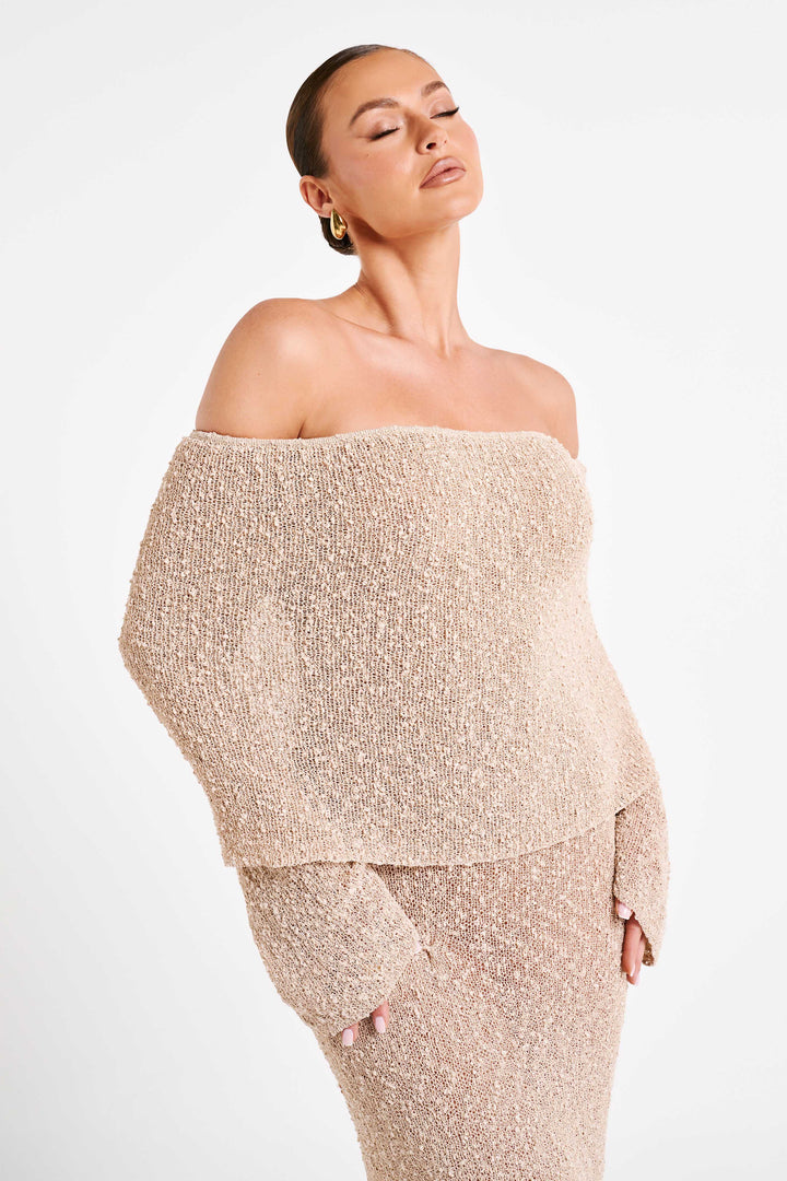 Stunning white textured off-shoulder maxi dress, elegant & ideal for luxury occasions.