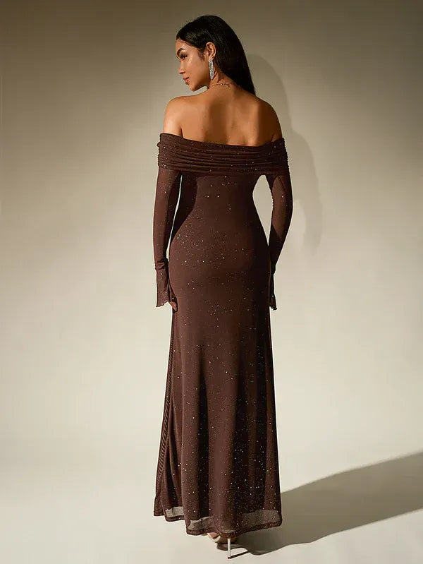 Chic black off-shoulder maxi dress with flowing sheer sleeves, ideal for parties.