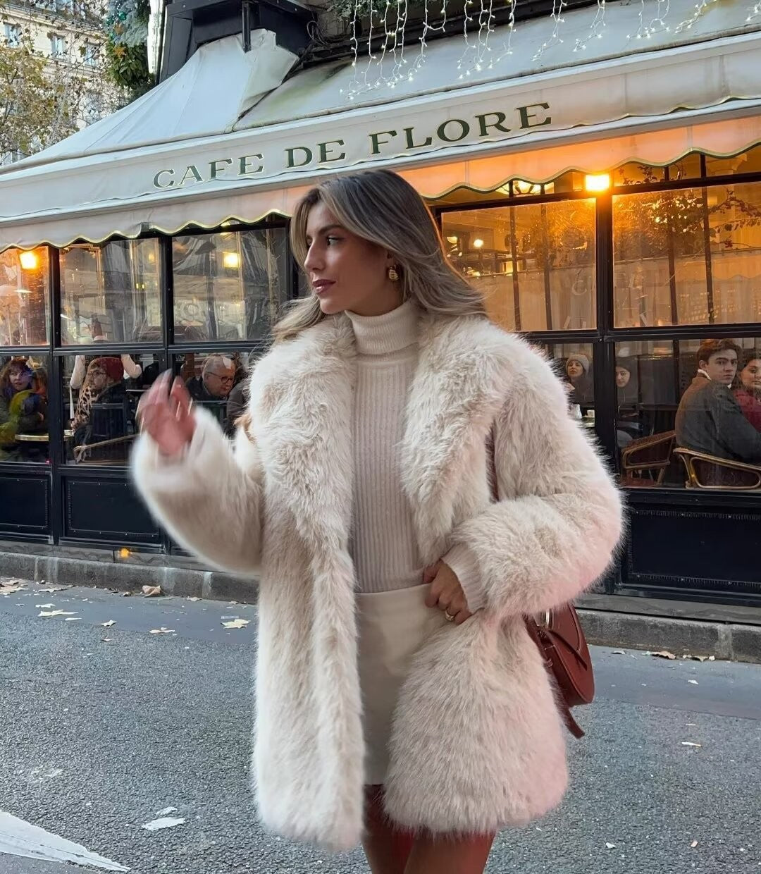 Elegant off-white women's faux fur jacket for cozy winter fashion.