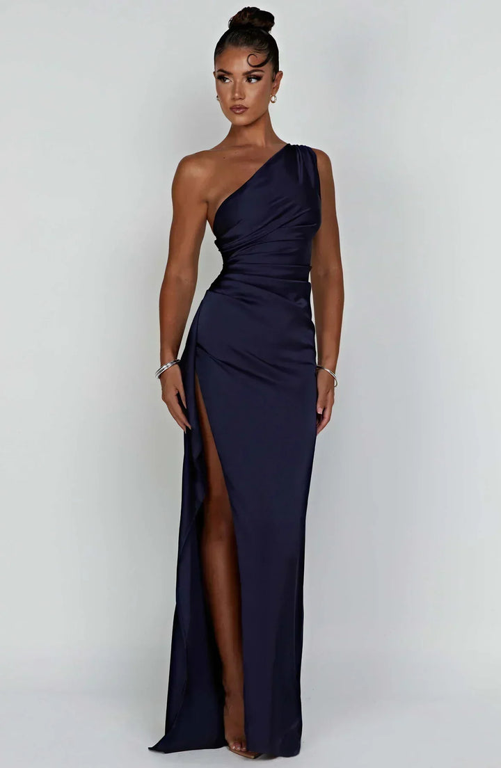 Women's one-shoulder red carpet dress, flowing maxi style with a high slit.