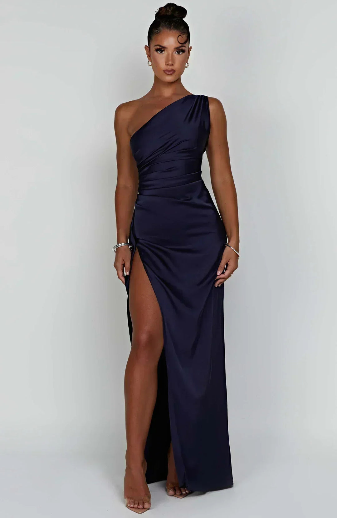 Stunning women's evening wear: one-shoulder maxi gown with an alluring high slit.