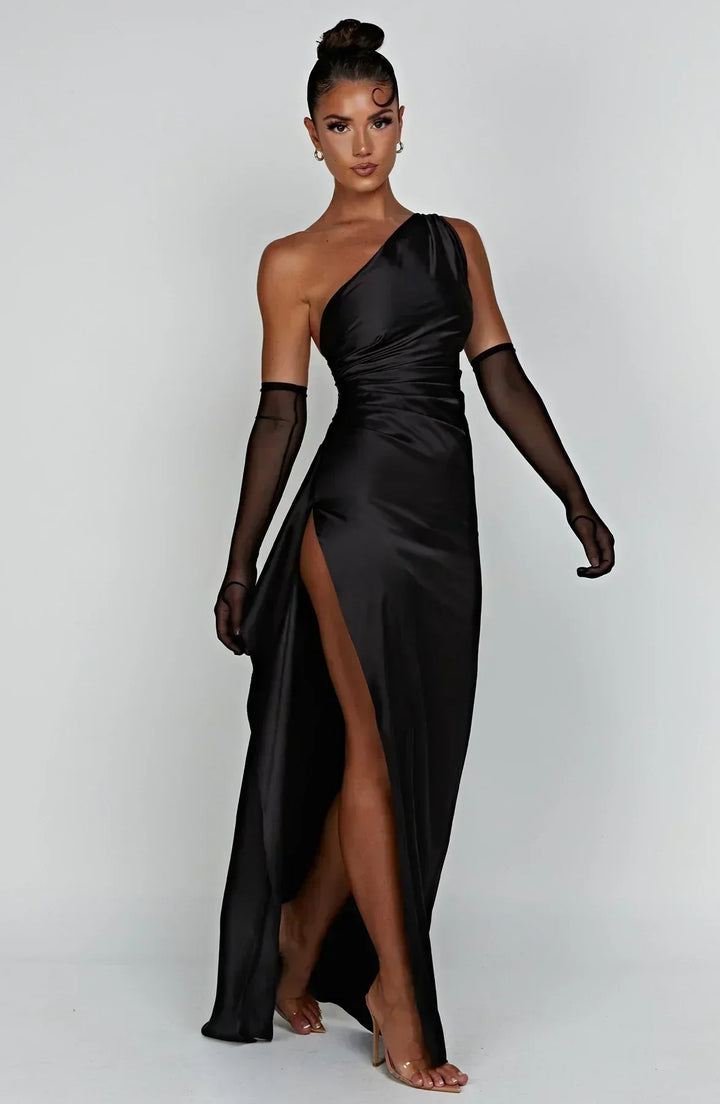 Formal women's one-shoulder gown, flowing maxi length, eye-catching high slit.