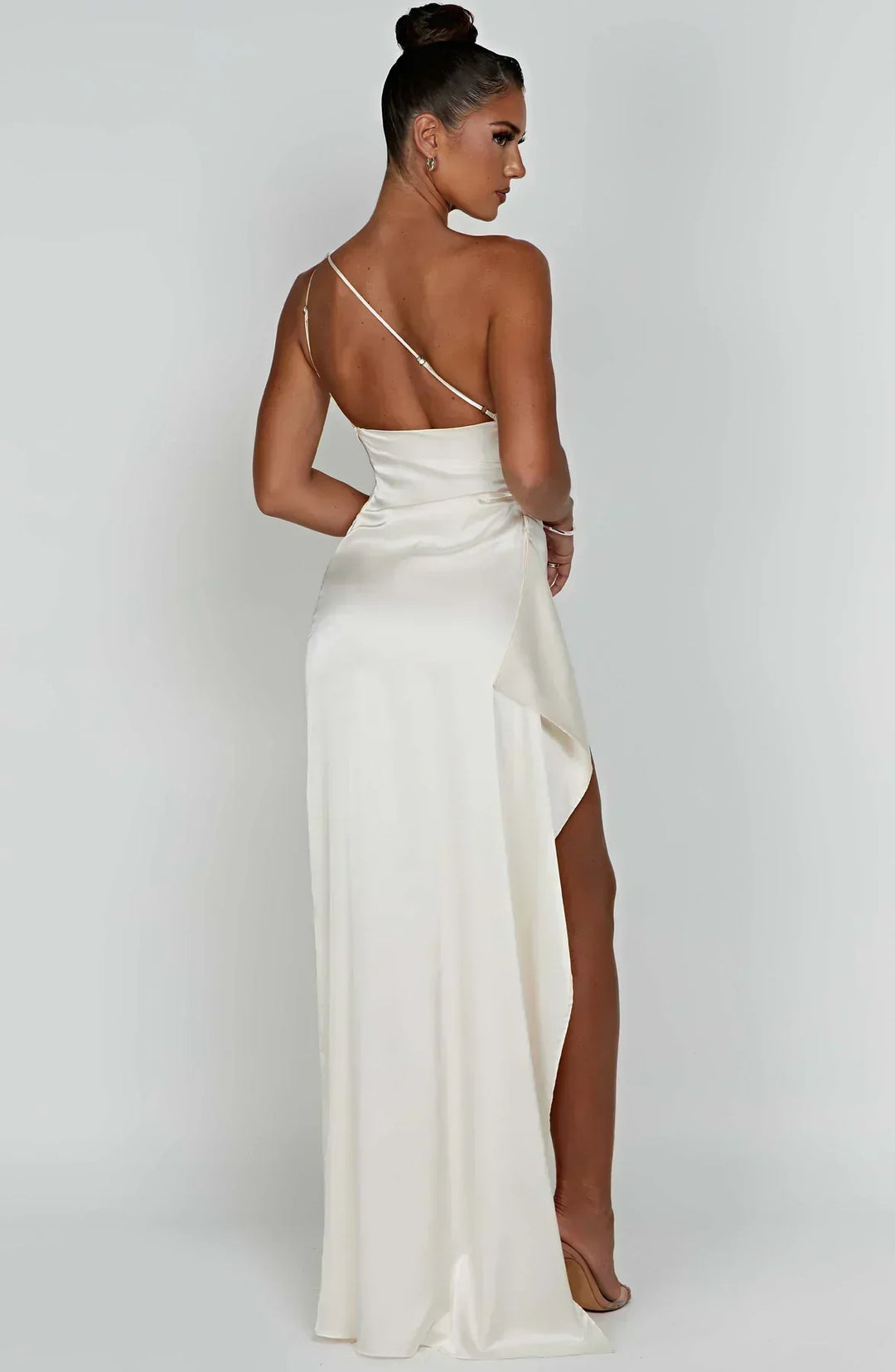 Women's fashion statement: one-shoulder maxi dress with an alluring high slit.