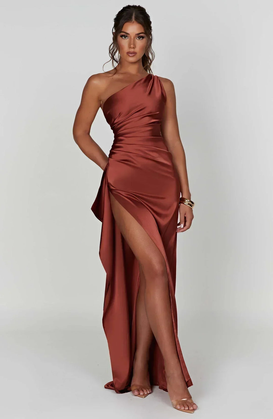 Formal women's one-shoulder evening dress, flowing maxi design, high slit.
